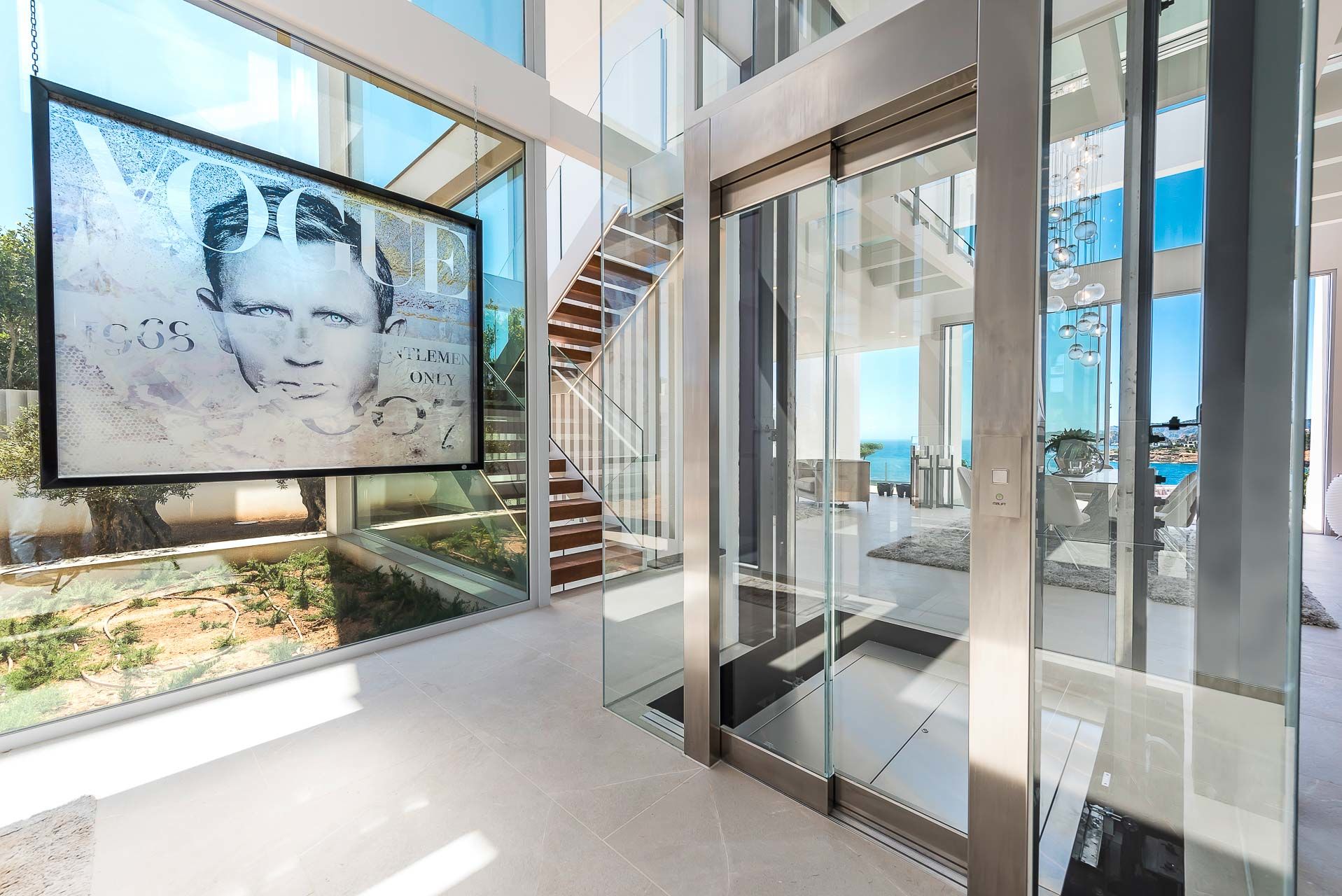 Entrance area with glass elevator
